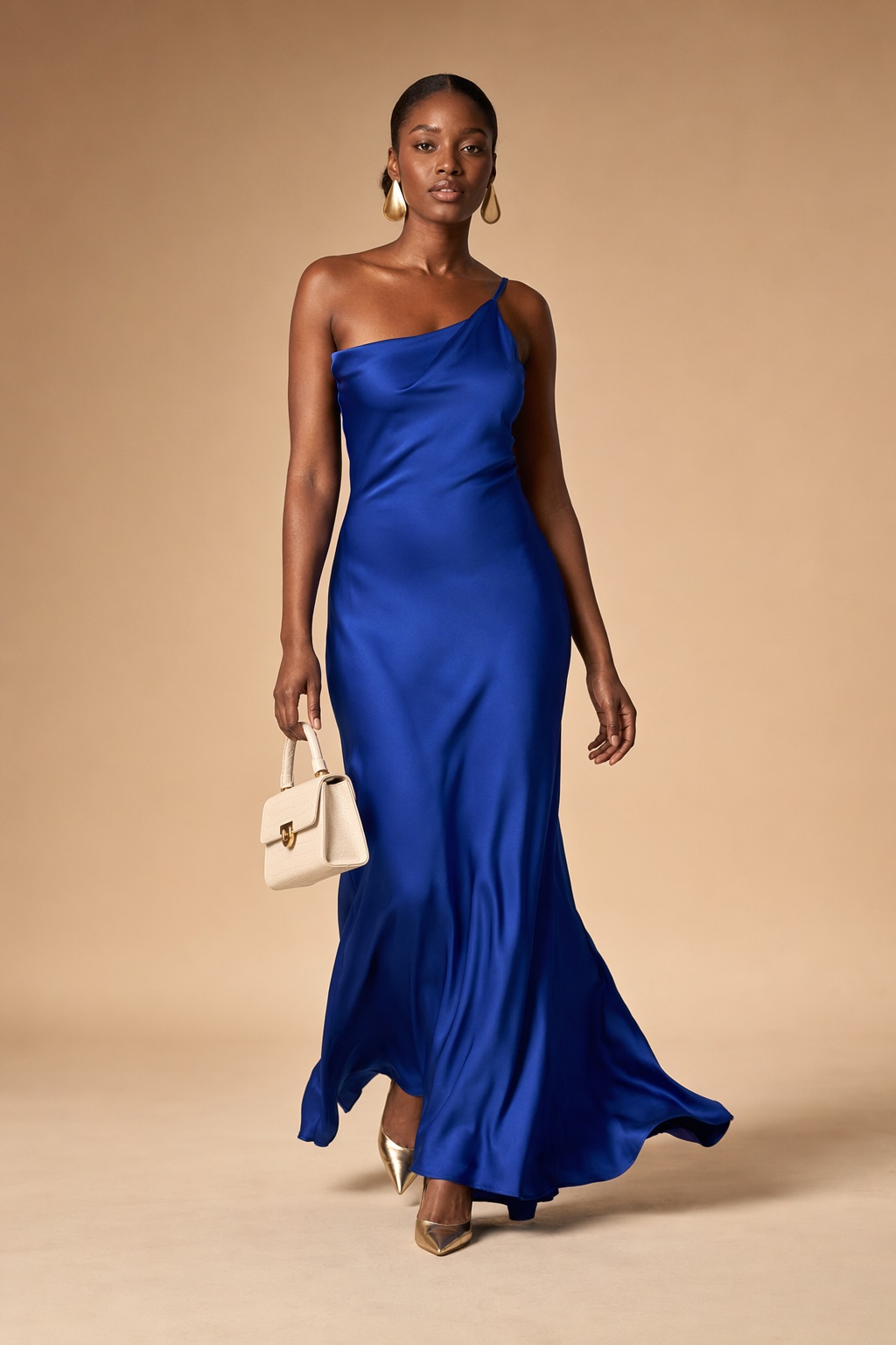 The look photographed mid-stride, the satin moving