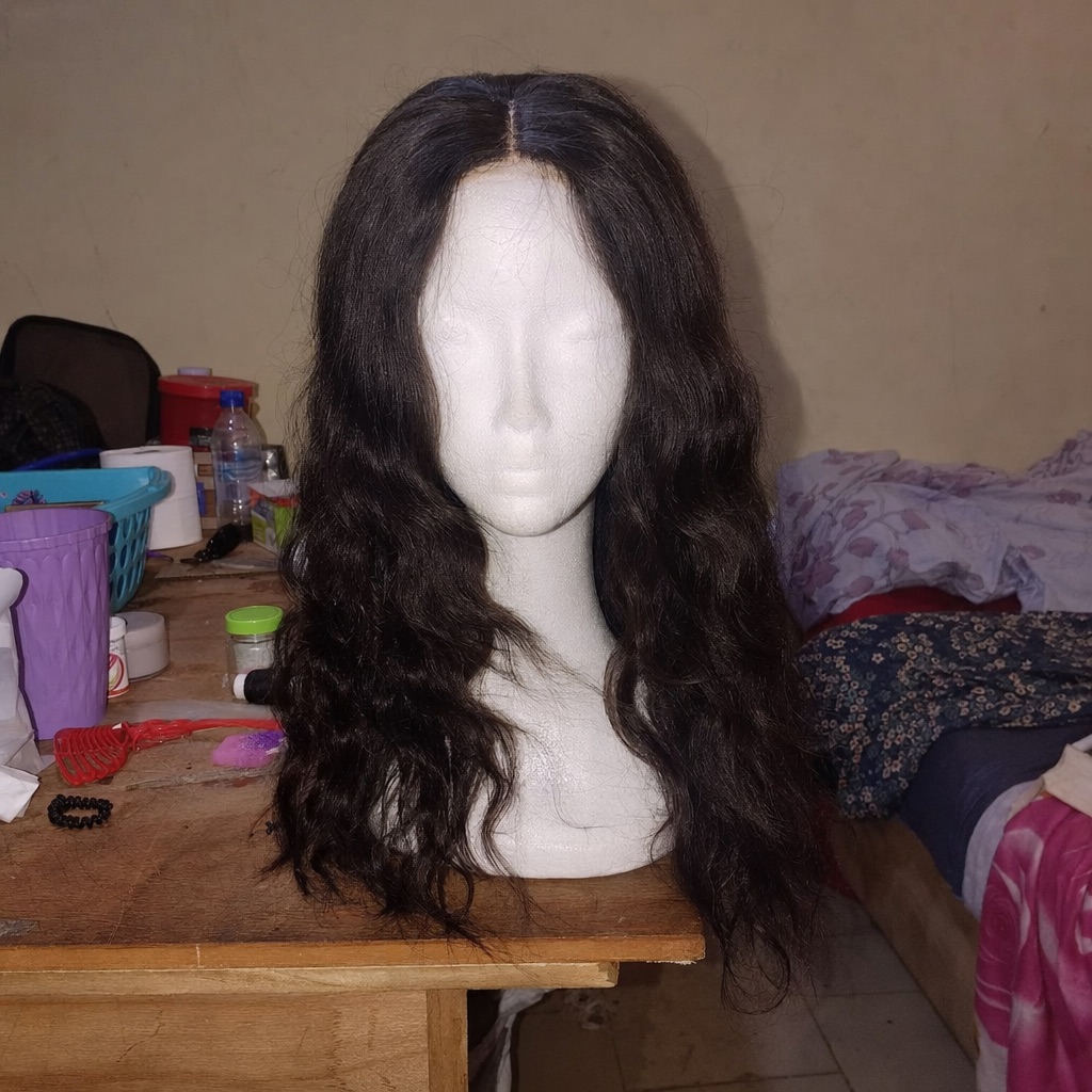 A wig, as a phone photo and as a finished studio frame